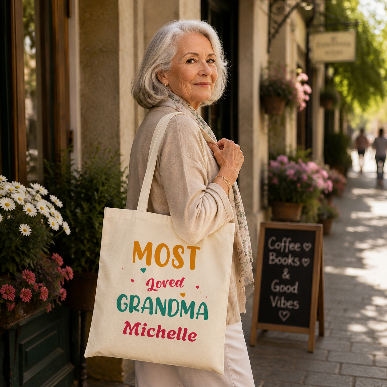 Colorful Grandma personalized tote shown held by the handles