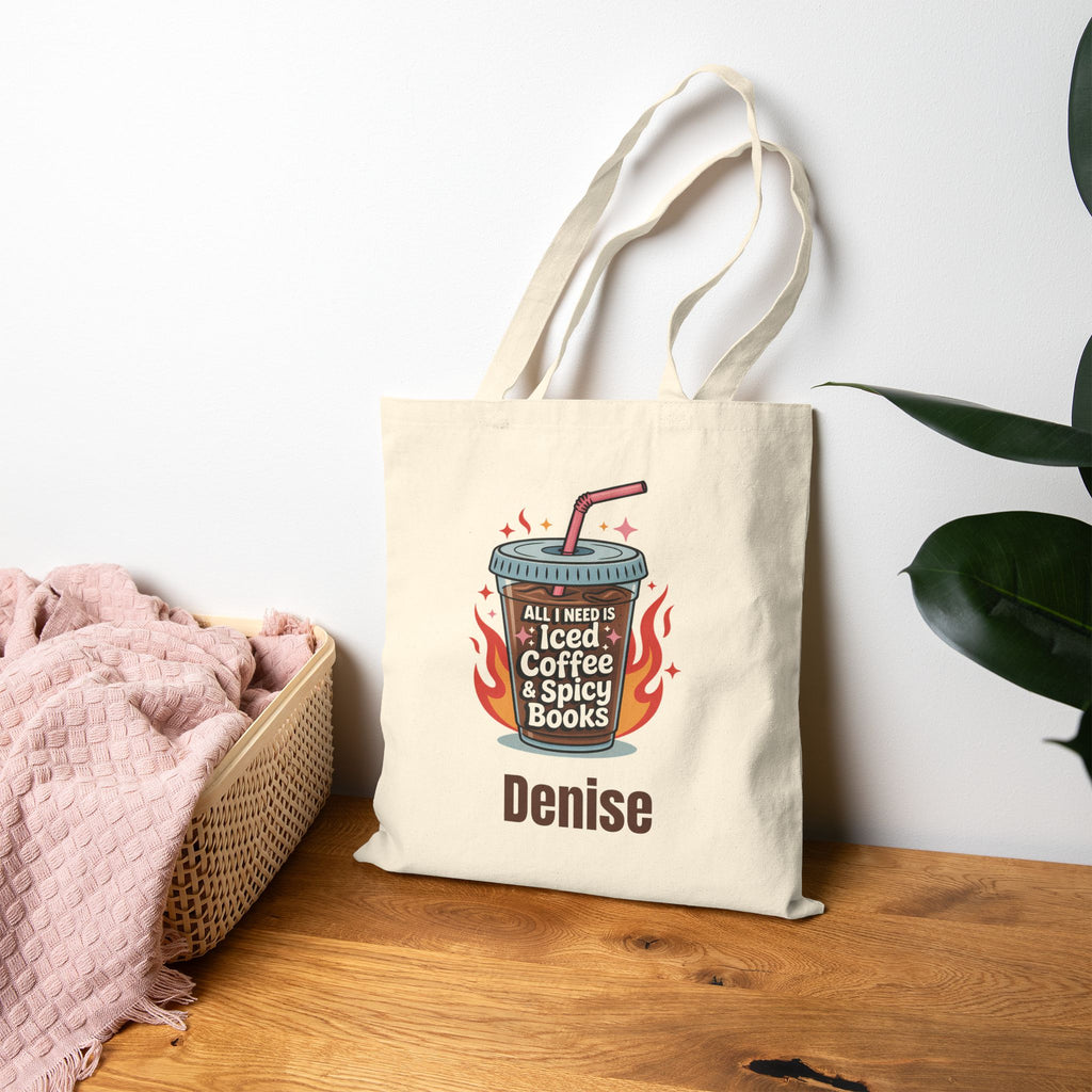 Natural canvas iced coffee and books tote bag in a home setting
