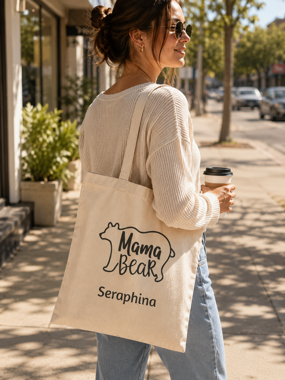 Mama Bear personalized tote bag shown held over the shoulder